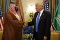 FILE- President Donald Trump shakes hands with Saudi Deputy Crown Prince and Defense Minister Moham…