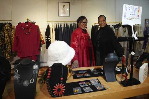 Claudia Averette, left, and her daughter, Atiya Smith pose for a photograph at their shop, Between …