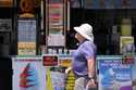 A person walks past an ice cream stand on the boardwalk, Thursday, June 2, 2022, in Ocean City, N