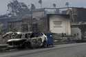 Fire-ravaged businesses and vehicles are left behind after the Palisades Fire swept through in the …