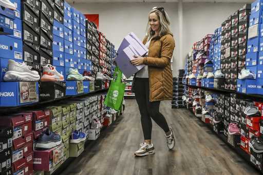 Ashley Crafton looks at tennis shoes at at Shoe Stop while shopping during Small Business Saturday …