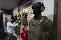 Veteran and business owner Jackson Dalton arranges protective gear at the Black Box Safety offices,…