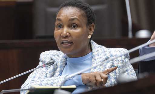 South Africa's justice minister Thembi Simelane gestures as she responds to corruption allegations …