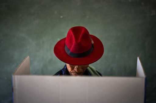 A voter fills out a ballot paper during general elections in Nkandla, Kwazulu Natal, South Africa, …