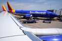 A Southwest Airlines Boeing 737 passenger jet sits at a gate at the Tulsa International Airport Sat…