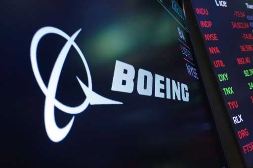 The logo for Boeing appears on a screen on the floor of the New York Stock Exchange, July 13, 2021