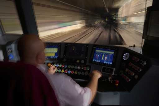 A subway driver operates the train's brake lever before entering a station in Barcelona, Spain, Mon…