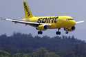 Passengers wait in a line for help at the Spirit Airlines ticket counter at the Tampa International…