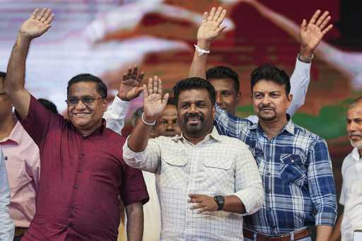 Sri Lankan President Anura Kumara Dissanayake waves with other candidates during a public rally ahe…