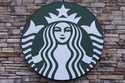 A Starbucks mermaid logo sign is displayed on a store, May 29, 2024, in Salem, N