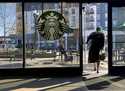 A customer exits a Starbucks store in Oakland, Calif