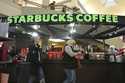 Shoppers at the Walden Galleria in Buffalo, NY, stop by the Starbucks kiosk on Saturday, November 3…