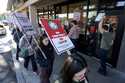 Starbuck workers picket outside of a closed Starbucks on Friday, December 20, 2024, in Burbank, Cal…