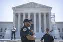 Supreme Court Police officers stand on duty outside of the Supreme Court building on Thursday, June…