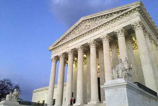 The Supreme Court at sunset in Washington, February 13, 2016. (AP Photo/Jon Elswick, File)