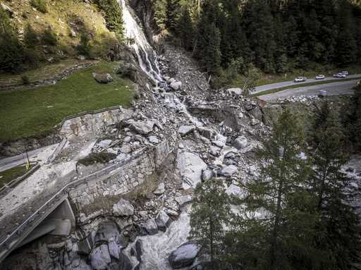 A road is blocked in Eisten, Switzerland, Friday, Sept