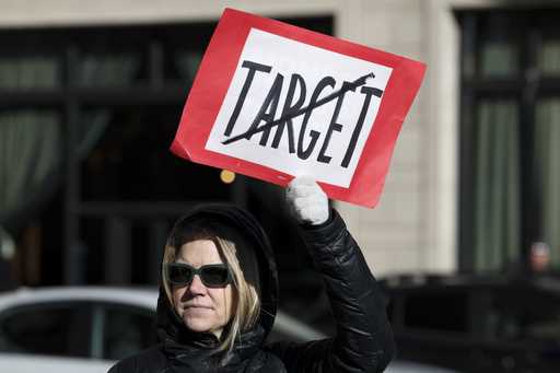 Becky Dankowski, center, of Minneapolis, who said she was a long-time customer, holds an anti-Targe…