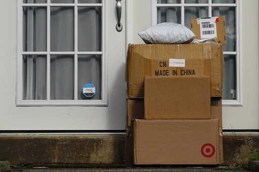 Packages are seen stacked on the doorstep of a residence, Wednesday, October 27, 2021, in Upper Dar…