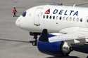 A Delta Air Lines jet leaves the gate, Friday, July 19, 2024, at Logan International Airport in Bos…