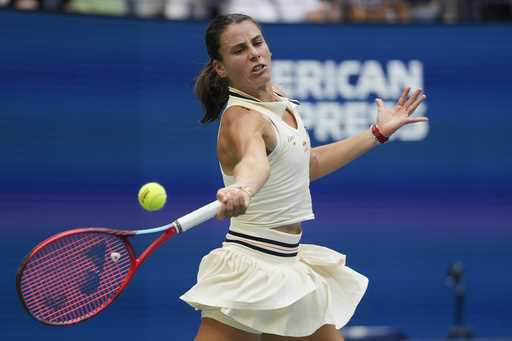 Emma Navarro, of the United States, returns a shot to Coco Gauff, of the United States, during the …