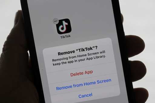 A TikTok app is shown on a phone in San Francisco, Friday, January 17, 2025. (AP Photo/Jeff Chiu)