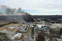 This photo taken with a drone shows portions of a Norfolk Southern freight train that derailed in E…