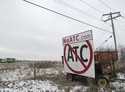 A sign against the proposed transmission line by American Transmission Company, ITC Midwest and Dai…