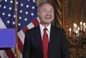 SoftBank Group CEO Masayoshi Son smiles as he listens to President-elect Donald Trump during a news…