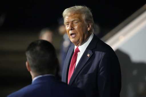 President Donald Trump is pictured before boarding Air Force One at the Naval Air Station Joint Res…