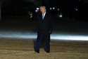 President Donald Trump waves as he walks from Marine One after arriving on the South Lawn of the Wh…