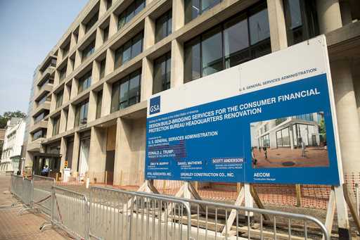 A sign stands at the construction site for the Consumer Financial Protection Bureau's headquarters …