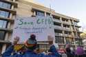 People attend a protest in support of the Consumer Financial Protection Bureau…