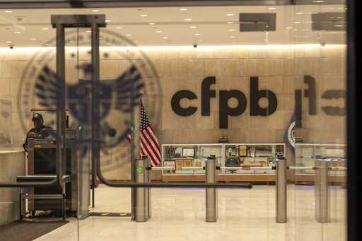 A security officer works inside of the Consumer Financial Protection Bureau…