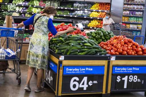 People buy groceries at a Walmart Superstore in Secaucus, New Jersey, July 11, 2024