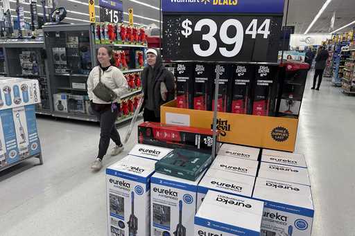 People shop for Black Friday deals at a Walmart store in Rochester, New York on Friday, November 29…