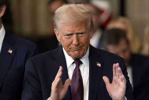 President Donald Trump gestures during the 60th Presidential Inauguration in the Rotunda of the U