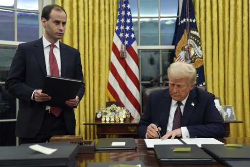 Howard Lutnick watches as President Donald Trump attends an indoor Presidential Inauguration parade…