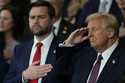 President Donald Trump and Vice President JD Vance listen to Christopher Macchio sing during the 60…