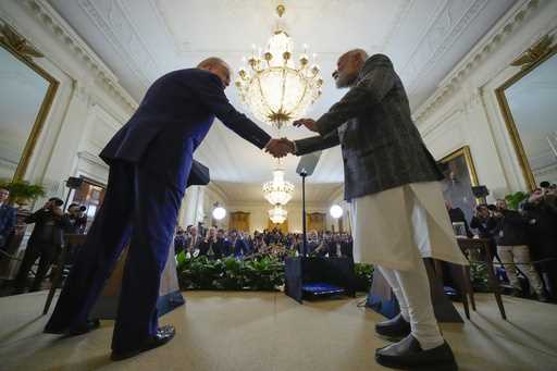 President Donald Trump and India's Prime Minister Narendra Modi shake hands during a news conferenc…