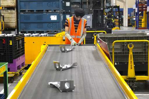 An employee works on the production line at the Martinrea auto parts manufacturing plant that suppl…