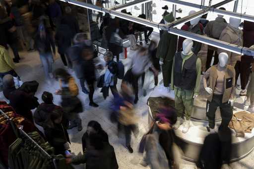 People shop at a retail store on Black Friday, November 25, 2022, in New York