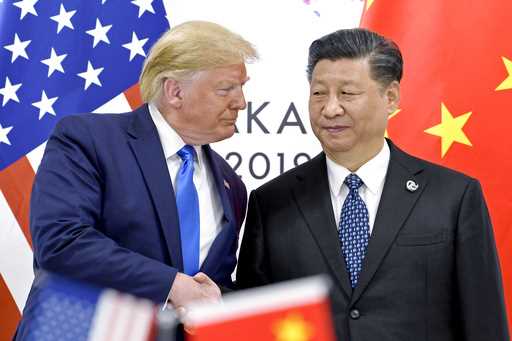 President Donald Trump, left, shakes hands with China's President Xi Jinping during a meeting on th…