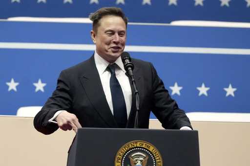 Elon Musk speaks at an indoor Presidential Inauguration parade event in Washington, January 20, 202…