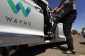 A Waymo minivan arrives to pick up passengers for an autonomous vehicle ride, Wednesday, April 7, 2…