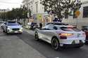 Two Waymo driverless taxis stop before passing one another on a San Francisco street on February 15…