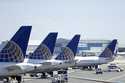 United Airlines jets sit at a gate at Terminal C of Newark Liberty International Airport in Newark,…