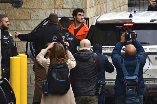 Suspect Luigi Mangione is taken into the Blair County Courthouse on Tuesday, December 10, 2024, in …