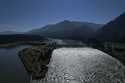 Water spills over the Bonneville Dam on the Columbia River, which runs along the Washington and Ore…