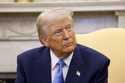 President Donald Trump listens during a meeting with France's President Emmanuel Macron in the Oval…