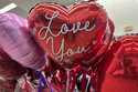 Valentine's Day balloons are displayed at a grocery store in Glenview, Ill